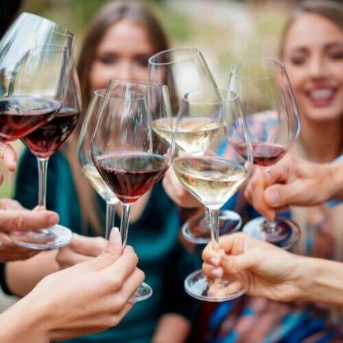 wine glasses being brought together in celebration